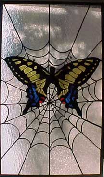 stained glass butterfly and spider web window