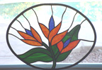 stained glass bird of paradice window