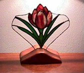 Crocus made of glass in a wooden stand 