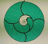 stained glass nautilus shell and teal glass circle