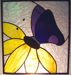 stained glass butterfly on flower