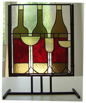 stained glass wine bottle and glasses in metal stand