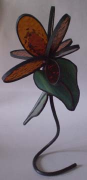abstract flower on copper tubing dark amber and green 8 inches $50