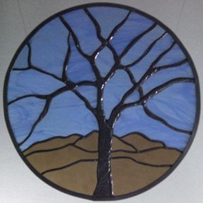 stained and leaded glass circle tree in blue and brown